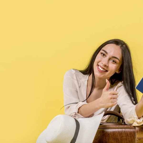 woman-with-tickets-giving-thumb-up